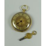 AN 18k ENGRAVED YELLOW GOLD ANTIQUE FOB WATCH WITH KEY WIND bearing Roman numerals to the floral