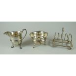 THREE SILVER ITEMS comprising toast-rack and matching cream jug and sugar basin, 7.4ozs