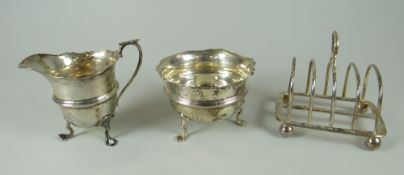 THREE SILVER ITEMS comprising toast-rack and matching cream jug and sugar basin, 7.4ozs