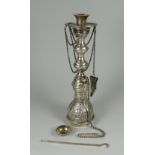 AN EGYPTIAN SILVER SHISHA HOOKAH with ladle and attachements and having a floral engraved body, 12.