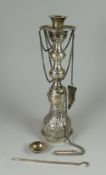 AN EGYPTIAN SILVER SHISHA HOOKAH with ladle and attachements and having a floral engraved body, 12.