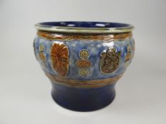 A DOULTON LAMBETH 'MAORI WARE' PLANTER with mask motifs and 'Kia Ora', 23cms diameter