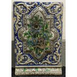A BELIEVED NINETEENTH CENTURY PERSIAN PAINTED WALL TILE probably of a palatial building & bearing