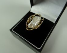 A 14k GOLD DIAMOND & NATURAL PEARL RING