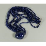 AN EIGHT STRAND LAPIS LAZULI BEAD NECKLACE & PENDANT, 45cms long Provenance: Estate of Helen