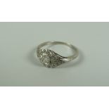 AN ANTIQUE 18k WHITE GOLD & PLATINUM DIAMOND CLUSTER RING, 2.3gms