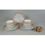 A PAIR OF ROYAL CHINA WORKS WORCESTER CUP & SAUCERS and spare saucer together with a Royal Crown