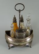 A GEORGE III SILVER CRUET STAND being mahogany lined and of gondola form raised over four feet and