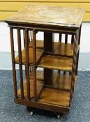 AN EARLY TWENTIETH CENTURY MAHOGANY REVOLVING BOOKCASE (structurally sound but requiring re