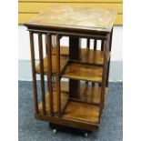 AN EARLY TWENTIETH CENTURY MAHOGANY REVOLVING BOOKCASE (structurally sound but requiring re