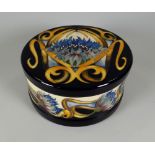 A 2012 MOORCROFT LIMITED EDITION (83/150) LIDDED BOWL in the Cornflower Cavalade pattern, signed V