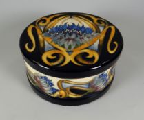 A 2012 MOORCROFT LIMITED EDITION (83/150) LIDDED BOWL in the Cornflower Cavalade pattern, signed V