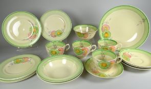 A CLARICE CLIFF PART-TEA SET comprising four cups, sugar basin, two fruit dishes, four saucers,