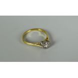 AN 18CT GOLD DIAMOND SOLITAIRE RING being round cut in an eight claw setting, visual estimate 0.