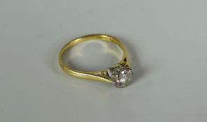 AN 18CT GOLD DIAMOND SOLITAIRE RING being round cut in an eight claw setting, visual estimate 0.