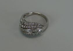 A MODERN 18CT WHITE GOLD DIAMOND CLUSTER RING