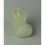 A CHINESE CARVED WHITE JADE TOGGLE of naturalistic form, 4cms long