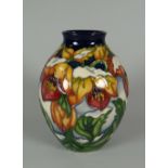 A 2008 MOORCROFT BALUSTER VASE WITH NARROW NECK by Rachel Bishop in the Winter Hellebore pattern,