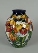 A 2008 MOORCROFT BALUSTER VASE WITH NARROW NECK by Rachel Bishop in the Winter Hellebore pattern,