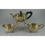 A THREE PIECE SILVER TEA-SET of fluted form and raised over claw feet, Sheffield 1938/39, 30ozs