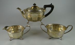 A THREE PIECE SILVER TEA-SET of fluted form and raised over claw feet, Sheffield 1938/39, 30ozs