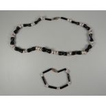 A BLACK, PINK & WHITE CORAL NECKLACE & MATCHING BRACELET necklace size 42cms