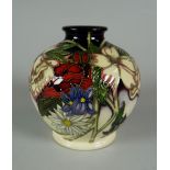 A 2009 MOORCROFT SQUAT NARROW NECK VASE in a trial for Ophelias Flowers pattern by V Lovatt, 12cms