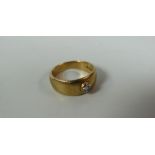 A 9CT YELLOW GOLD & DIAMOND BAND RING, with single raised round-cut diamond, 5.8gms