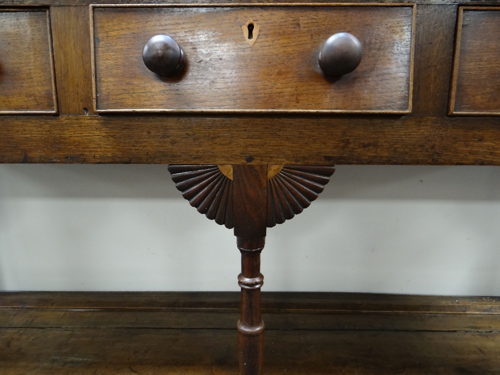 A NINETEENTH CENTURY OAK SWANSEA WELSH DRESSER having a three-drawer base raised over a platform & - Image 2 of 2