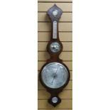 A NINETEENTH CENTURY ROSEWOOD WHEEL BAROMETER having three silvered dials, circular convex mirror,