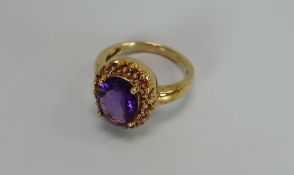 A 9CT YELLOW GOLD & AMETHYST OVAL RING