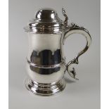 A RARE GEORGE III SILVER TANKARD by William Grundy, 1766 of baluster form on spreading circular