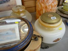 Parcel of vintage lampshades and a circular portrait mirror