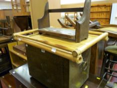 Beaten metal log box with ring handles, a bamboo tray and a small vintage bookshelf