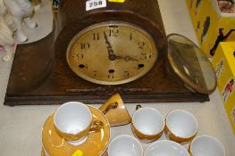 Polished mantel clock and a quantity of lustre coffeeware