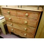 Victorian stripped pine chest of two short over three long drawers on bun feet