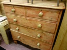 Victorian stripped pine chest of two short over three long drawers on bun feet