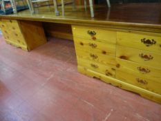 Pair of pine effect eight drawer chests with 11ft top board
