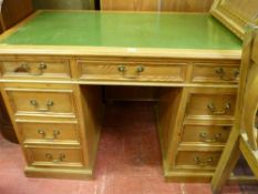 Excellent reproduction pine twin pedestal desk with green gilt tooled leather top