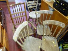 Three spindlebacked farmhouse chairs, an antique rush seated armchair and a circular seated bar