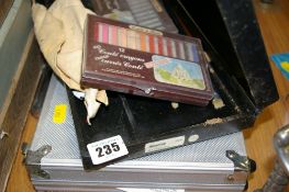 Cased poker kit and a cased box of artist's pastels etc