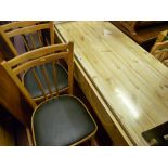 Pine effect formica topped kitchen table and two chairs