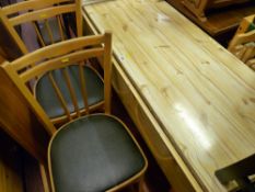 Pine effect formica topped kitchen table and two chairs