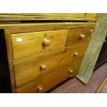 Stripped pine chest of two short over two long drawers