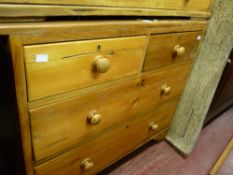 Stripped pine chest of two short over two long drawers