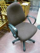 Upholstered swivel office armchair