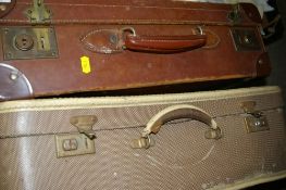 Vintage leather suitcase and a retro suitcase