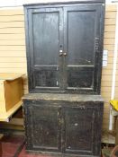 AN EARLY 19th CENTURY PINE HOUSEKEEPER'S CUPBOARD having twin two panel upper doors and two base