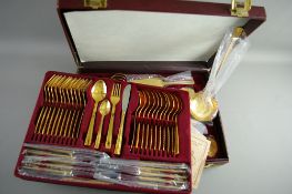 A CANTEEN OF BESTECKE SOLINGEN TWENTY THREE/FOUR CARAT GOLD PLATED CUTLERY, twelve place settings