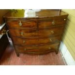 A GEORGIAN MAHOGANY BOW FRONT CHEST of two short over three long drawers, pine lined with circular